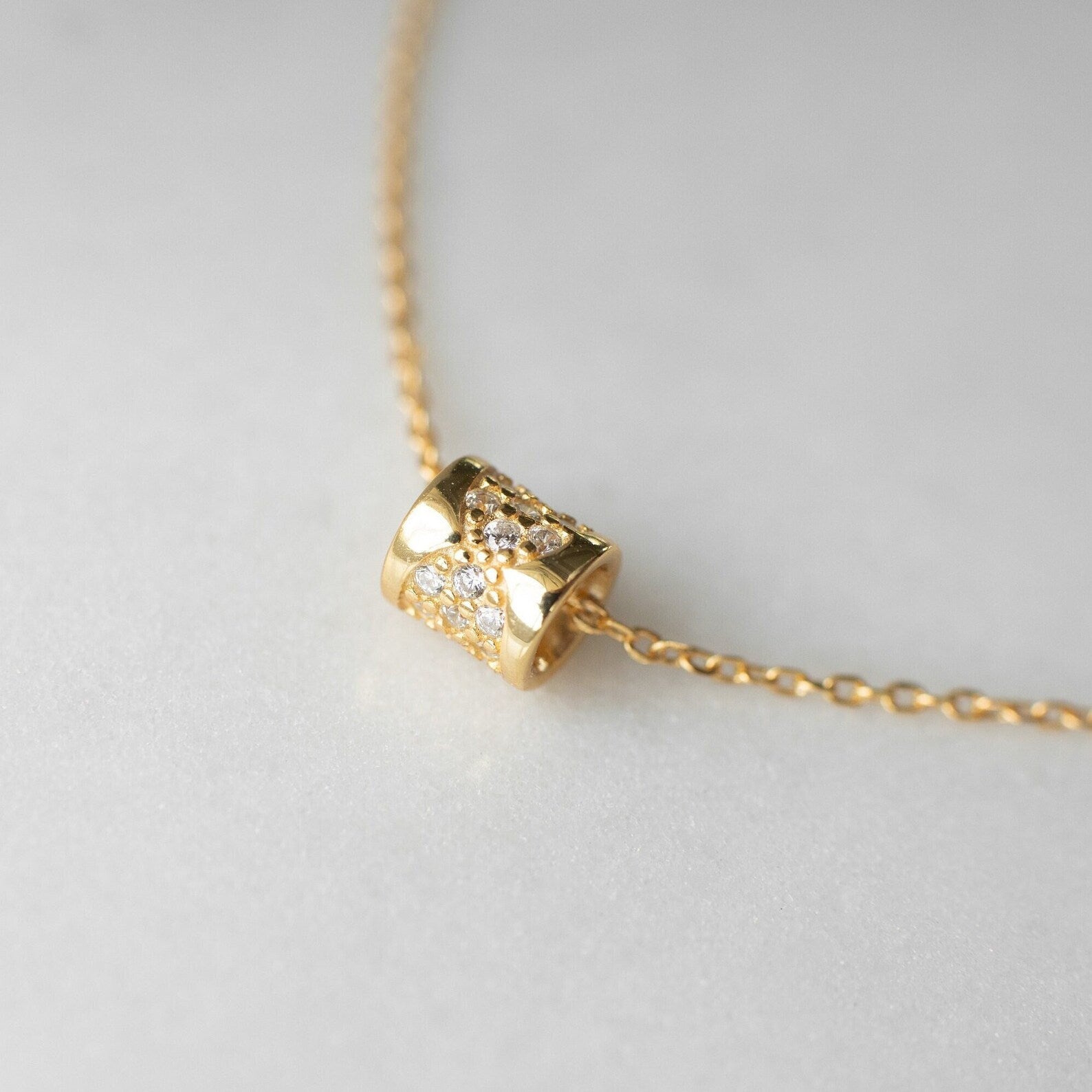 Gold cylinder pendant discount